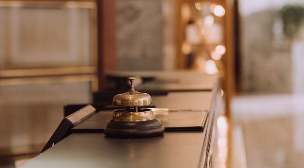Old school push bell on a hotel front desk